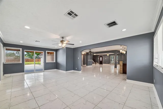 a view of big yard with a house in the background