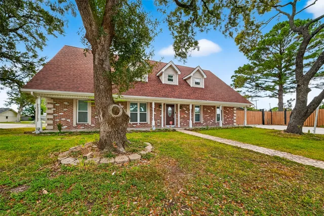 a large bedroom with a large bed and a chandelier
