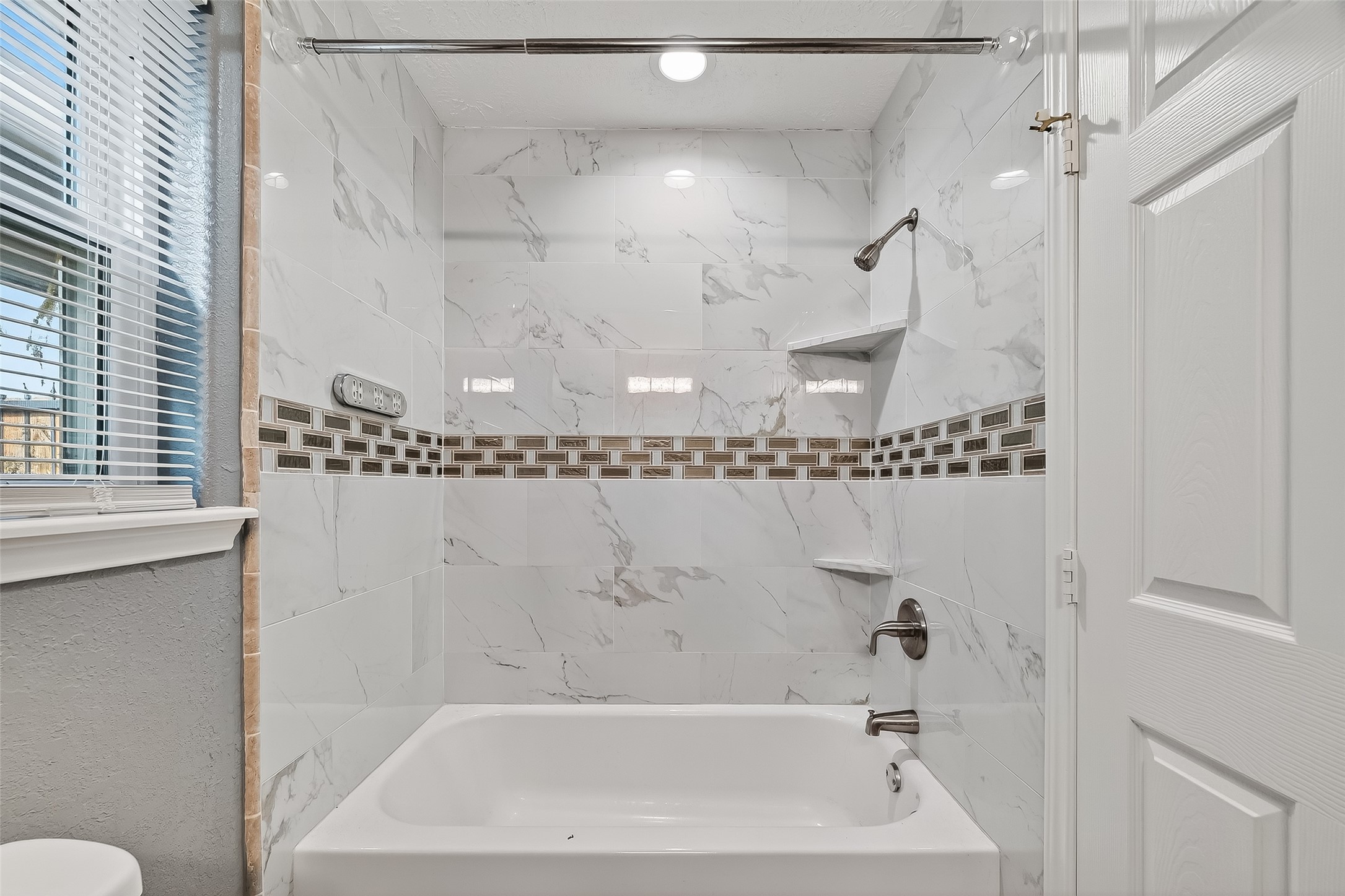 4901 Burning Tree Drive Baytown, TX 77521 - Photo 28 of 47 a bathroom with a bathtub and a shower