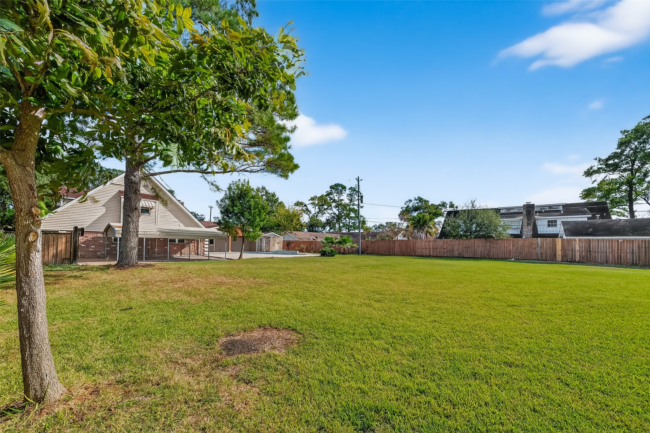 4901 Burning Tree Drive Baytown, TX 77521 - Photo 42 of 47 a view of big yard with a house in the background