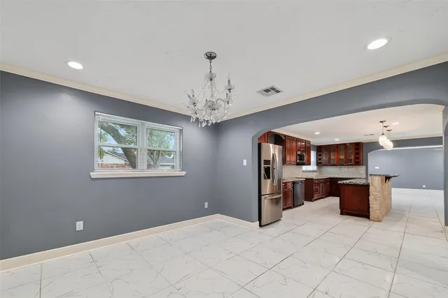a view of a hallway with a livingroom