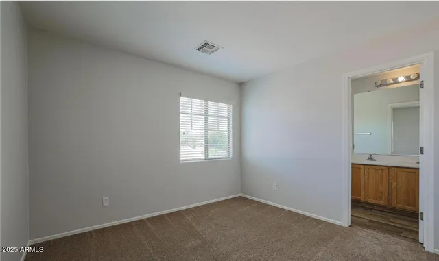 an empty room with a bathroom