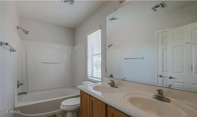 a view of a room that has a window and a washer