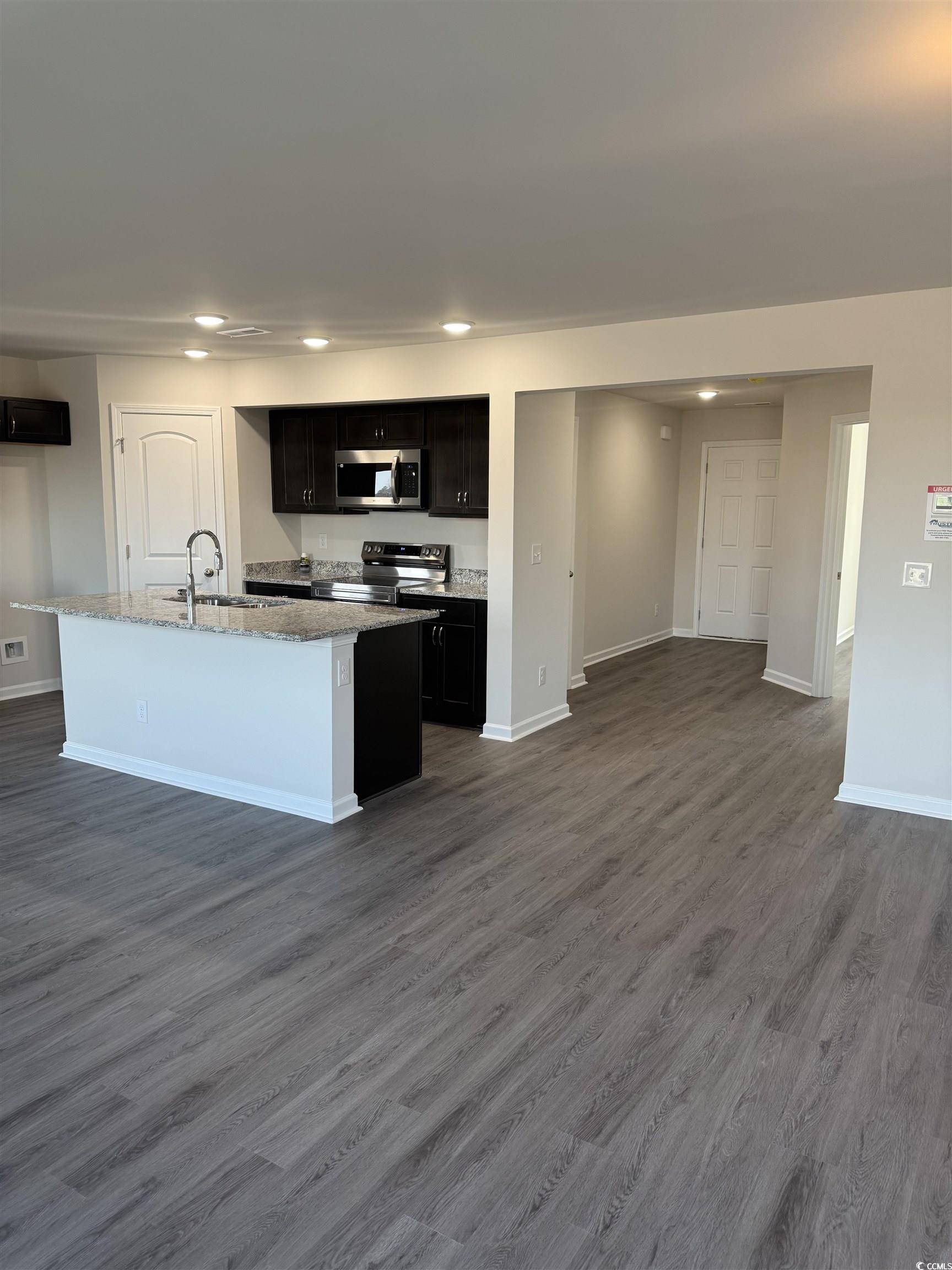 889 Busy Corner Road Conway, SC 29527 - Photo 7 of 25 Kitchen featuring dark wood-style flooring, stainl