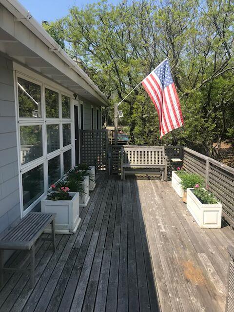 445 Sail Walk Fire Island Pines, NY 11770 - Photo 6 of 6 a view of balcony with wooden floor and outdoor seating