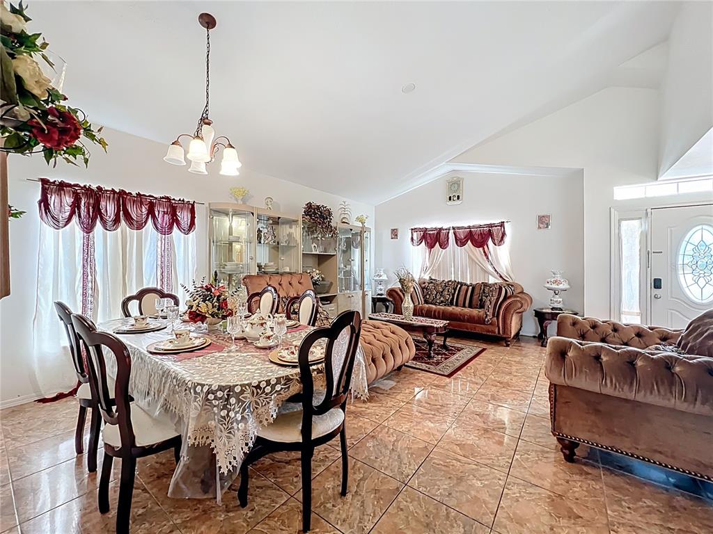 7939 Riffle Lane Orlando, FL 32818 - Photo 7 of 52 a view of a livingroom and dining room