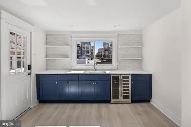 a large room with a large window and double vanity