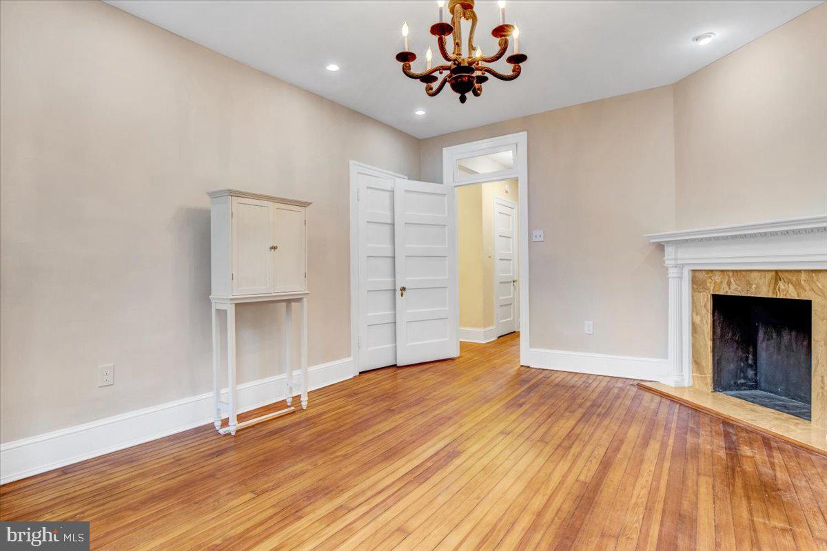 1133 Columbia Road Northwest Washington, DC 20009 - Photo 27 of 57 Bedroom with faux marble fireplace