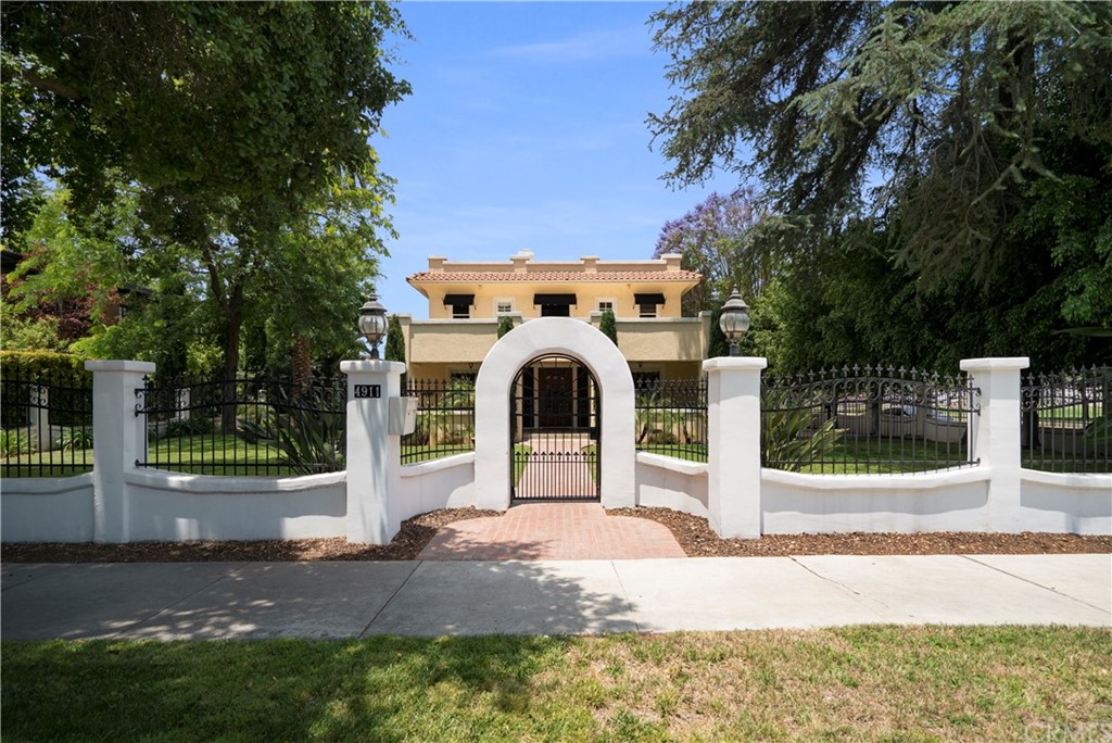 4911 Magnolia Avenue Riverside, CA 92506 - Photo 1 of 1 a front view of a house with a yard