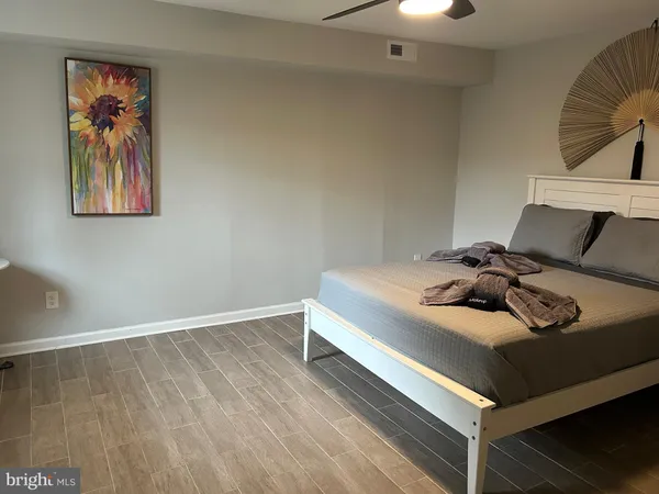 a bedroom with a bed and a couch