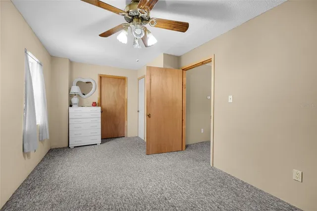 a bathroom with a sink a mirror a bathtub and shower