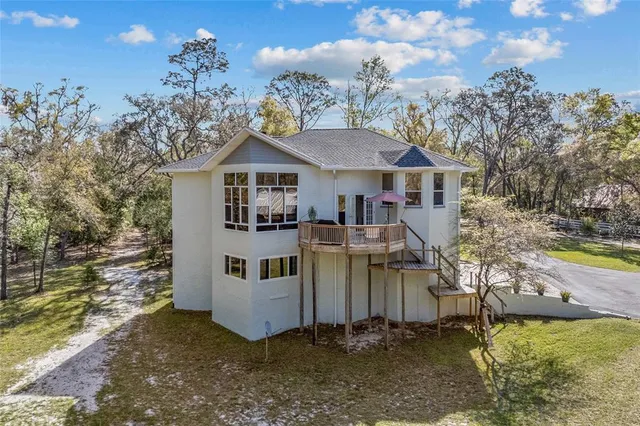 a view of a house with a big yard