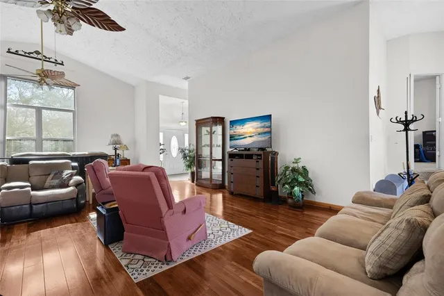 a living room with furniture or couch and a flat screen tv
