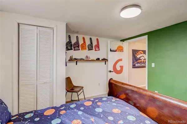 a bedroom with furniture and a window
