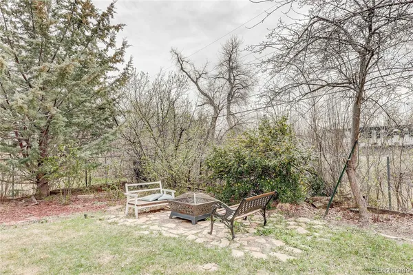 a view of a backyard with sitting area
