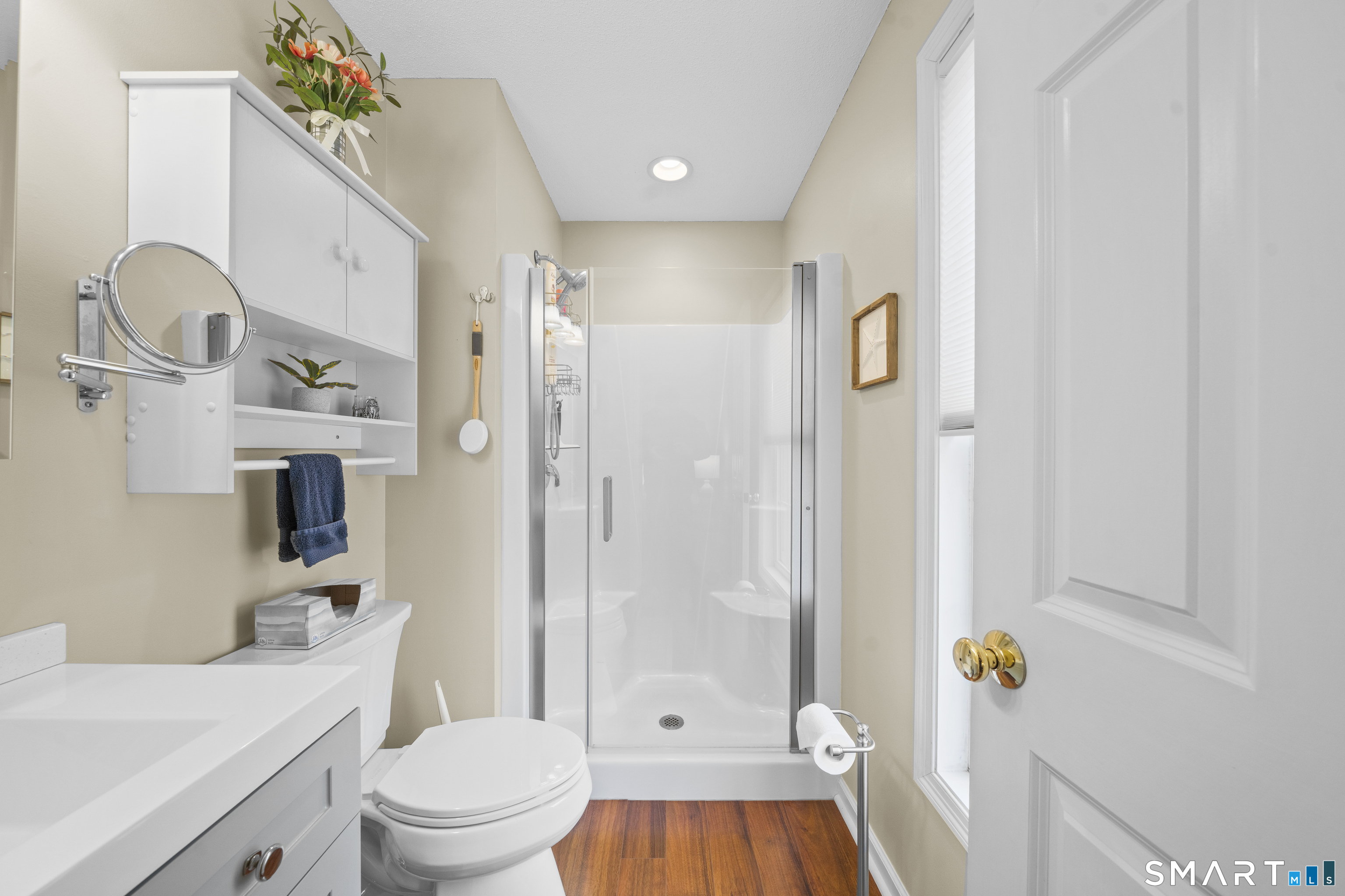 7 Heather Lane, Unit 7 Suffield, CT 06078 - Photo 19 of 34 a bathroom with a sink a toilet and shower