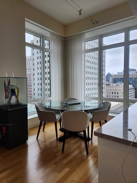 400 Stuart Street, Unit 18K Boston, MA 02116 - Photo 11 of 31 a view of a workspace with furniture and a window