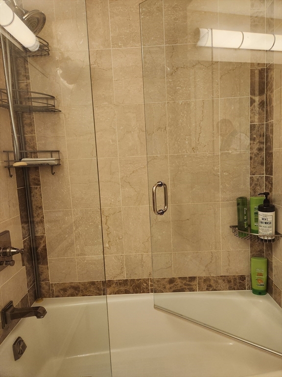 400 Stuart Street, Unit 18K Boston, MA 02116 - Photo 23 of 29 a bathroom with a shower