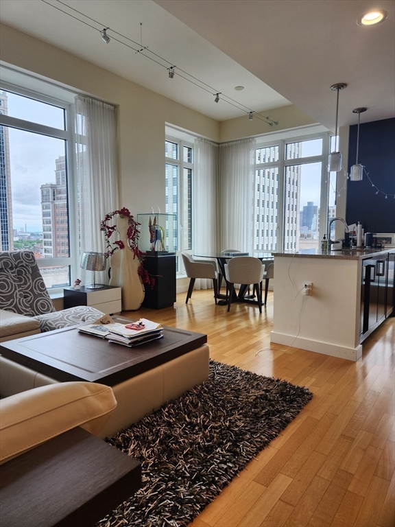 400 Stuart Street, Unit 18K Boston, MA 02116 - Photo 8 of 31 a living room with furniture and a large window