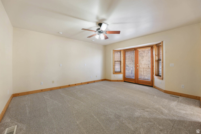 605 North Loafer Canyon Road Elk Ridge, UT 84651 - Photo 7 of 53 Primary bedroom with french doors leading to large deck