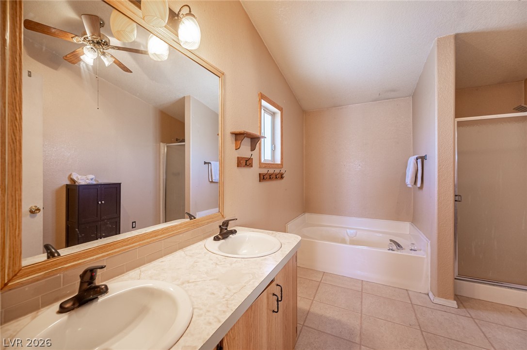 3200 Maple Road Pahrump, NV 89048 - Photo 37 of 53 Indulge in a tranquil retreat featuring a spacious soaking tub and dual vanities.