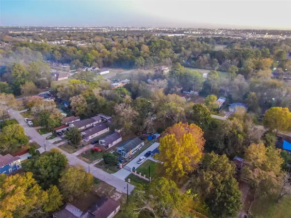 an aerial view of residential houses with outdoor space