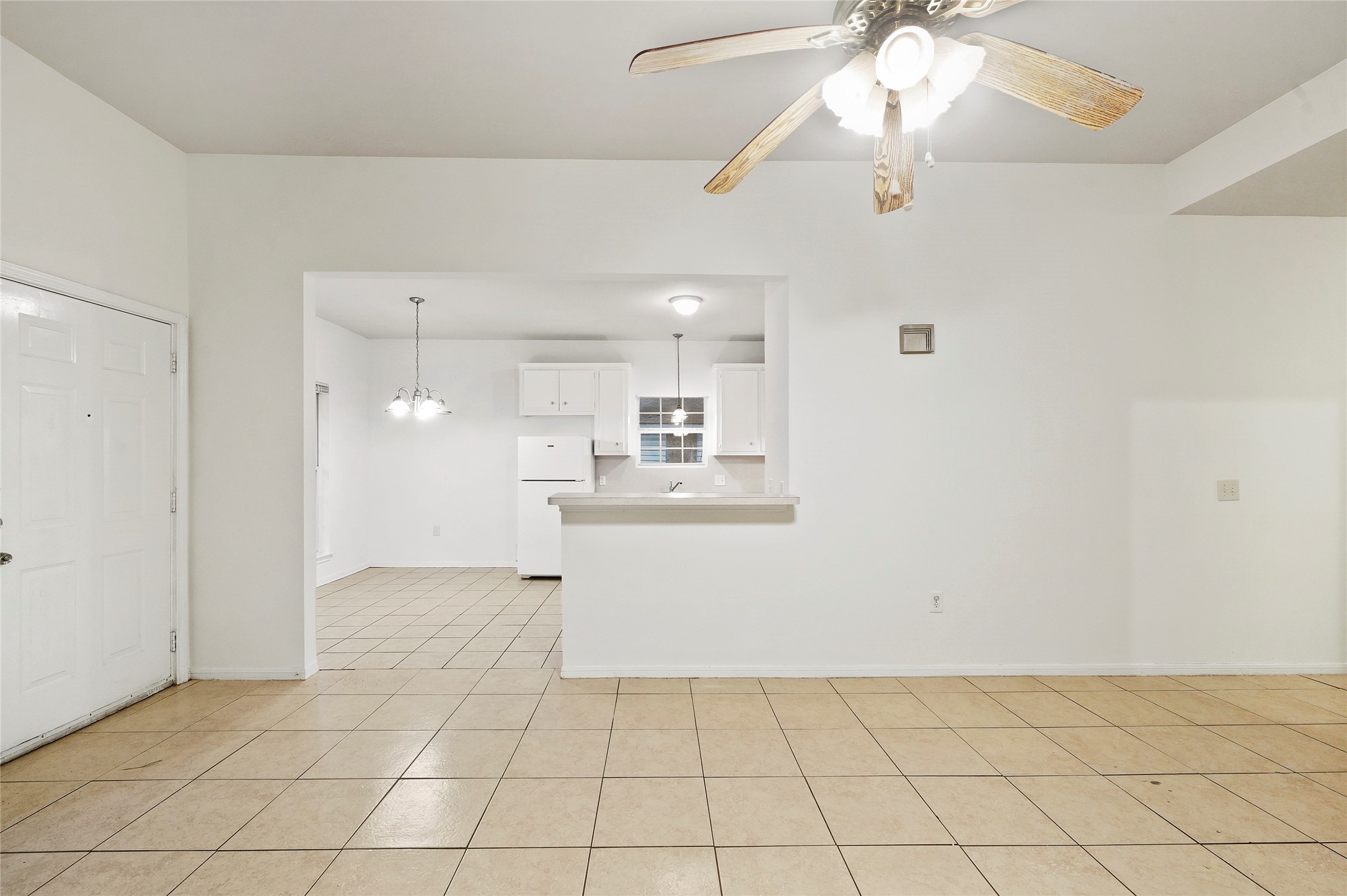 5502 Finch Street, Unit B Houston, TX 77028 - Photo 10 of 37 a view of kitchen and empty room with wooden floor