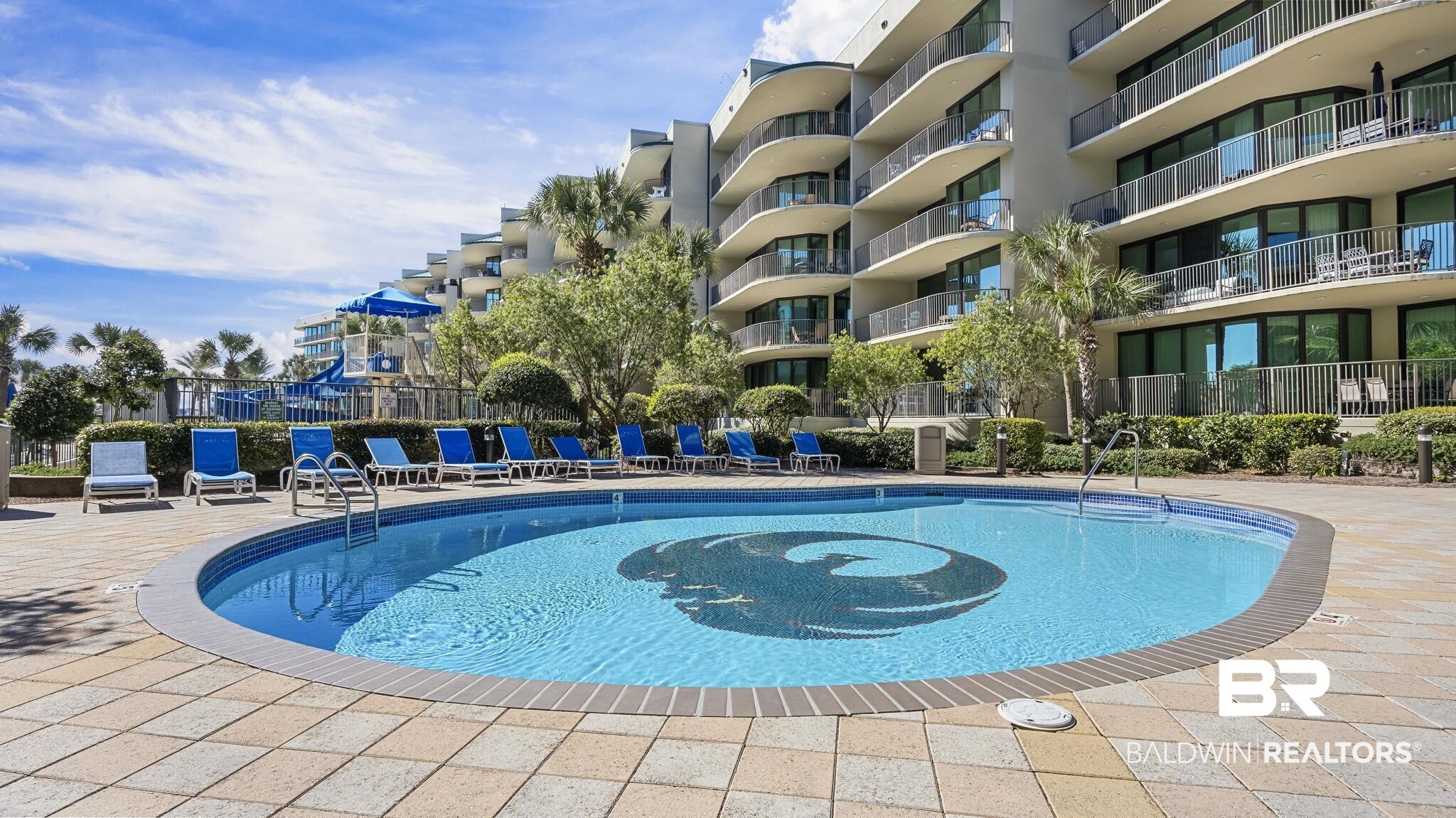 27580 Canal Road, Unit 1526 Orange Beach, AL 36561 - Photo 33 of 49 Community pool featuring a patio area