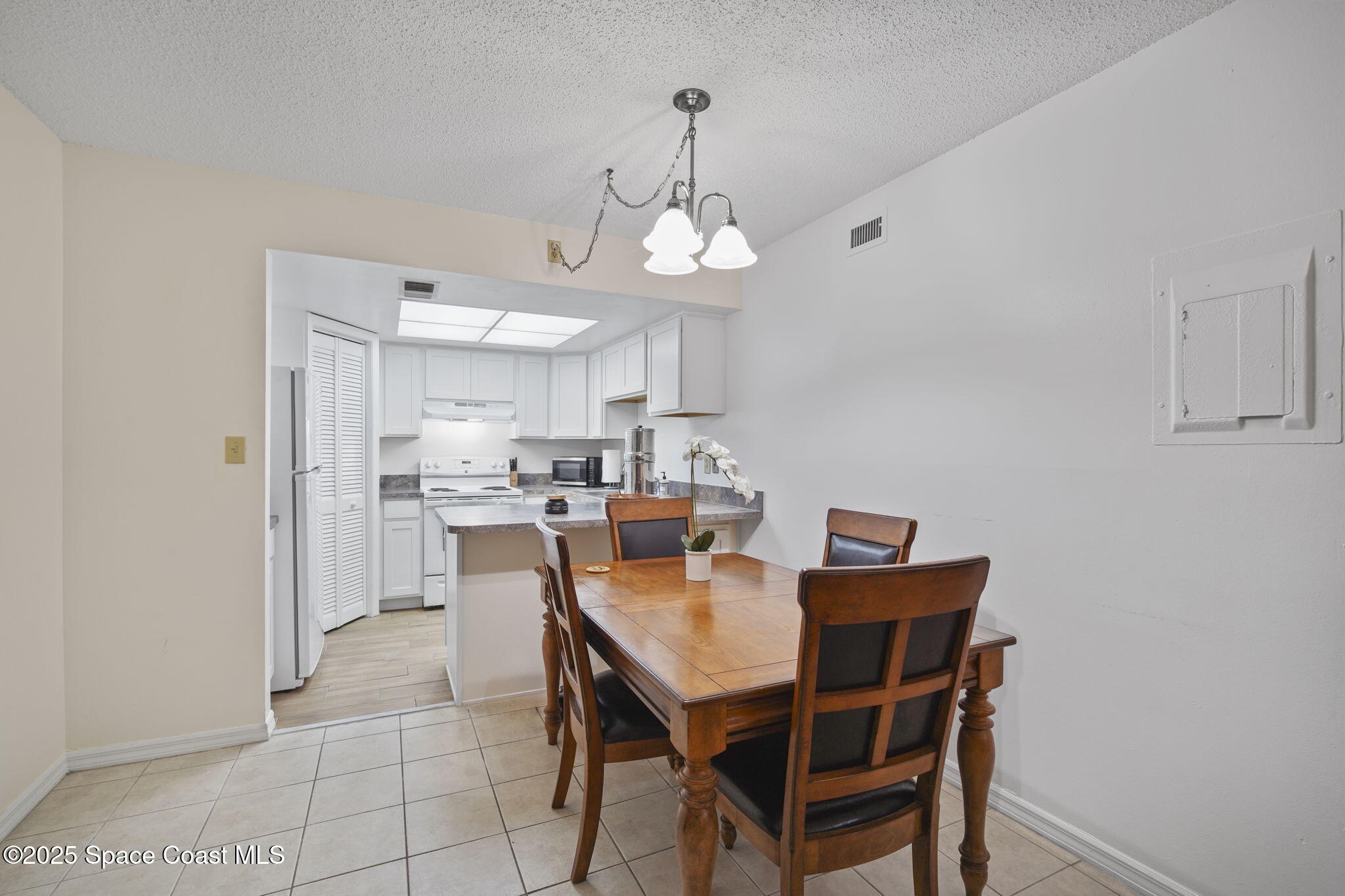 4133 Cedar Creek Circle, Unit 303 Merritt Island, FL 32953 - Photo 10 of 24 12-web-or-mls-CEDAR CREEK_DINING6