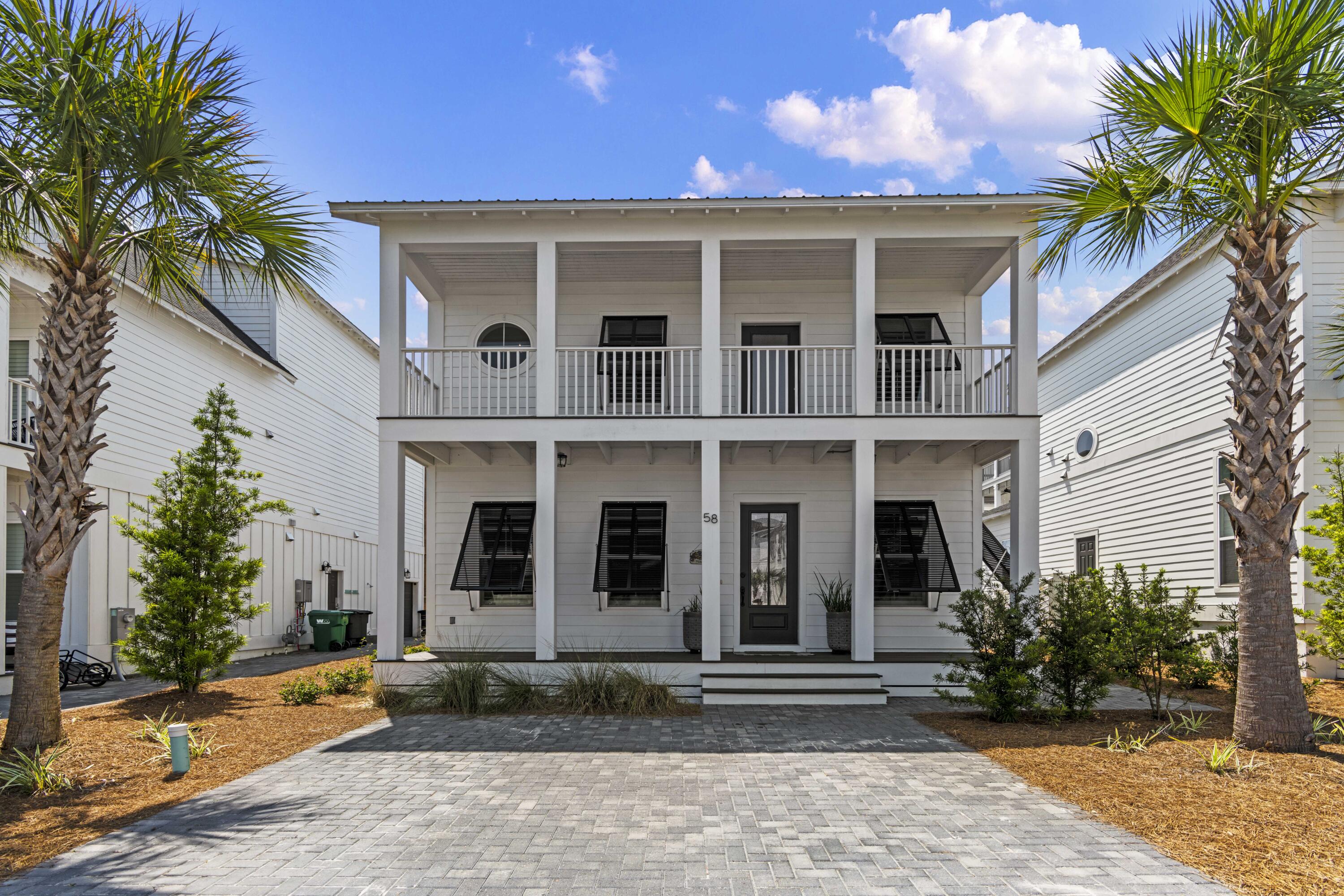 58 Beach View Drive Inlet Beach, FL 32461 - Photo 1 of 47 a front view of a house with garden