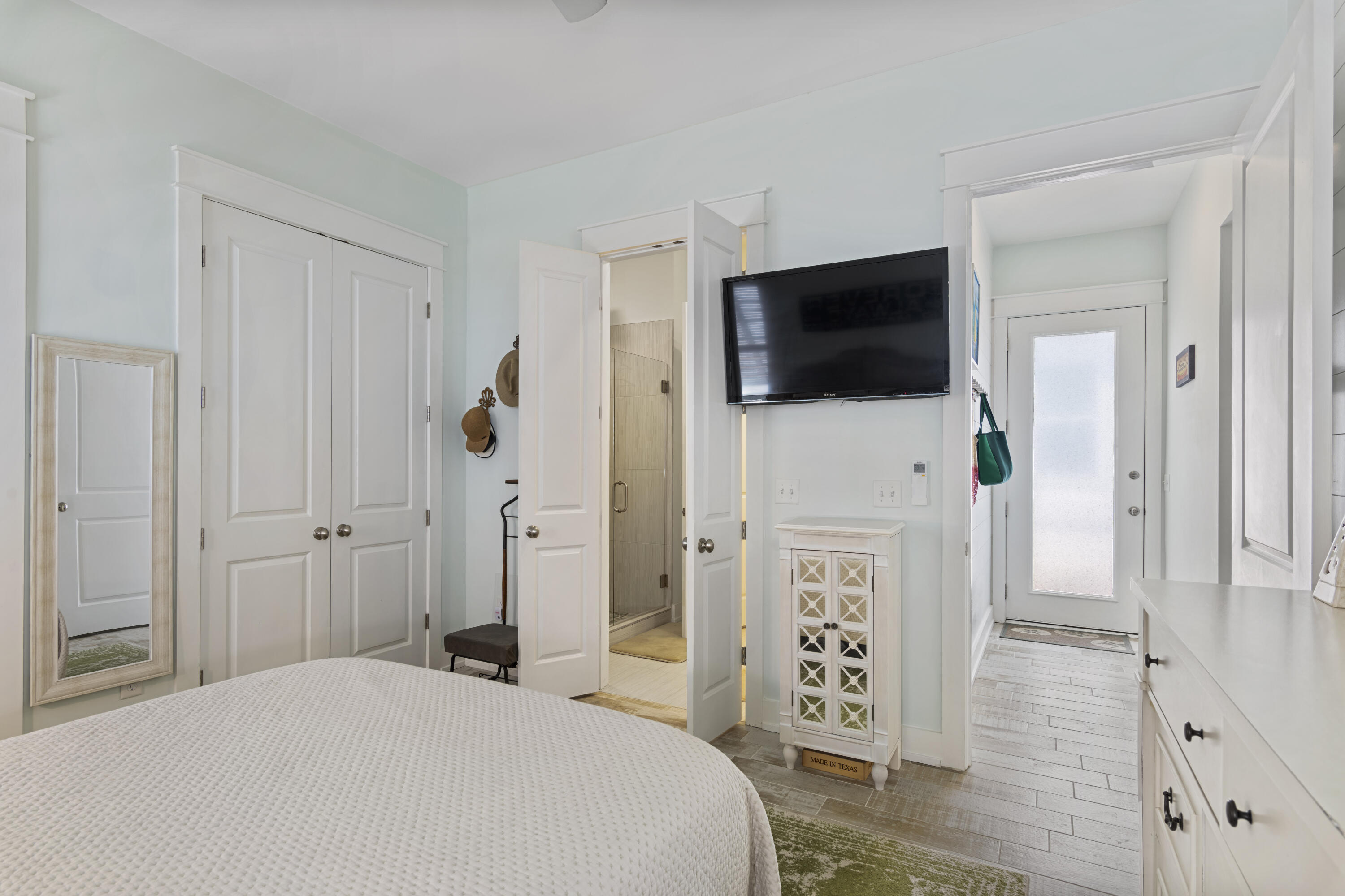 58 Beach View Drive Inlet Beach, FL 32461 - Photo 24 of 47 a bedroom with a bed a flat screen tv and dresser