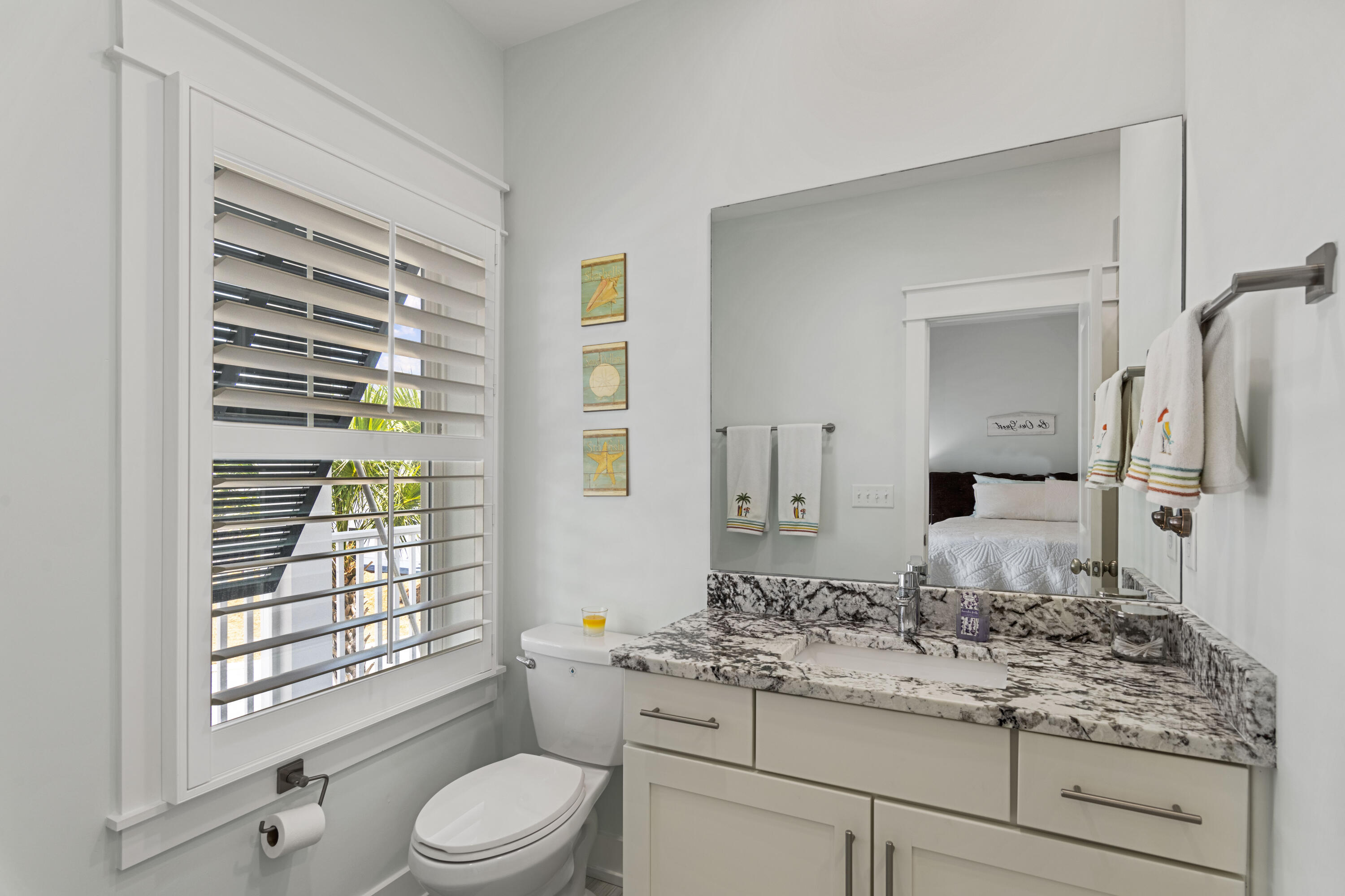 58 Beach View Drive Inlet Beach, FL 32461 - Photo 30 of 47 a bathroom with a granite countertop sink toilet a mirror and shower