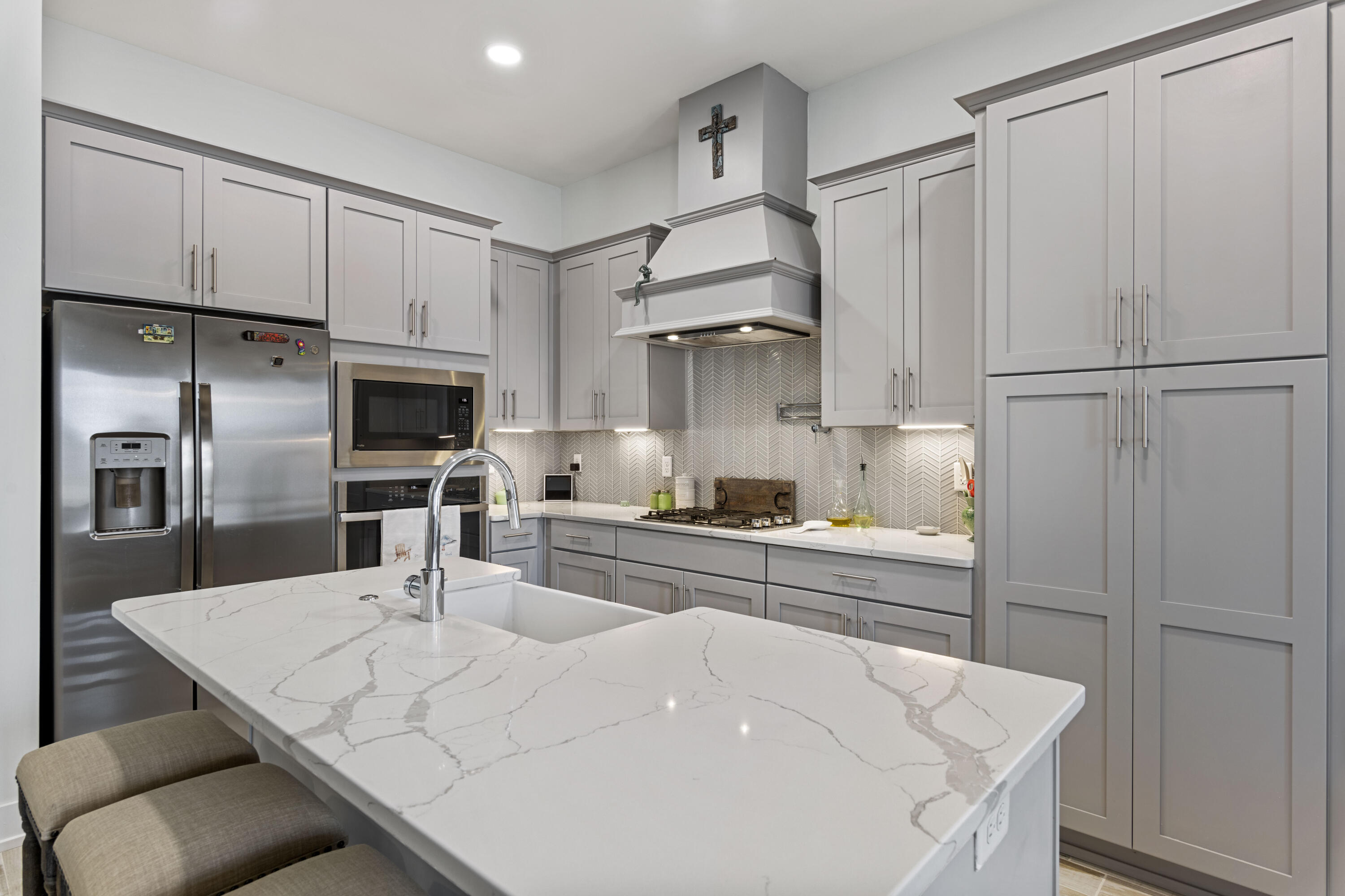 58 Beach View Drive Inlet Beach, FL 32461 - Photo 3 of 47 a kitchen with white cabinets and stainless steel appliances