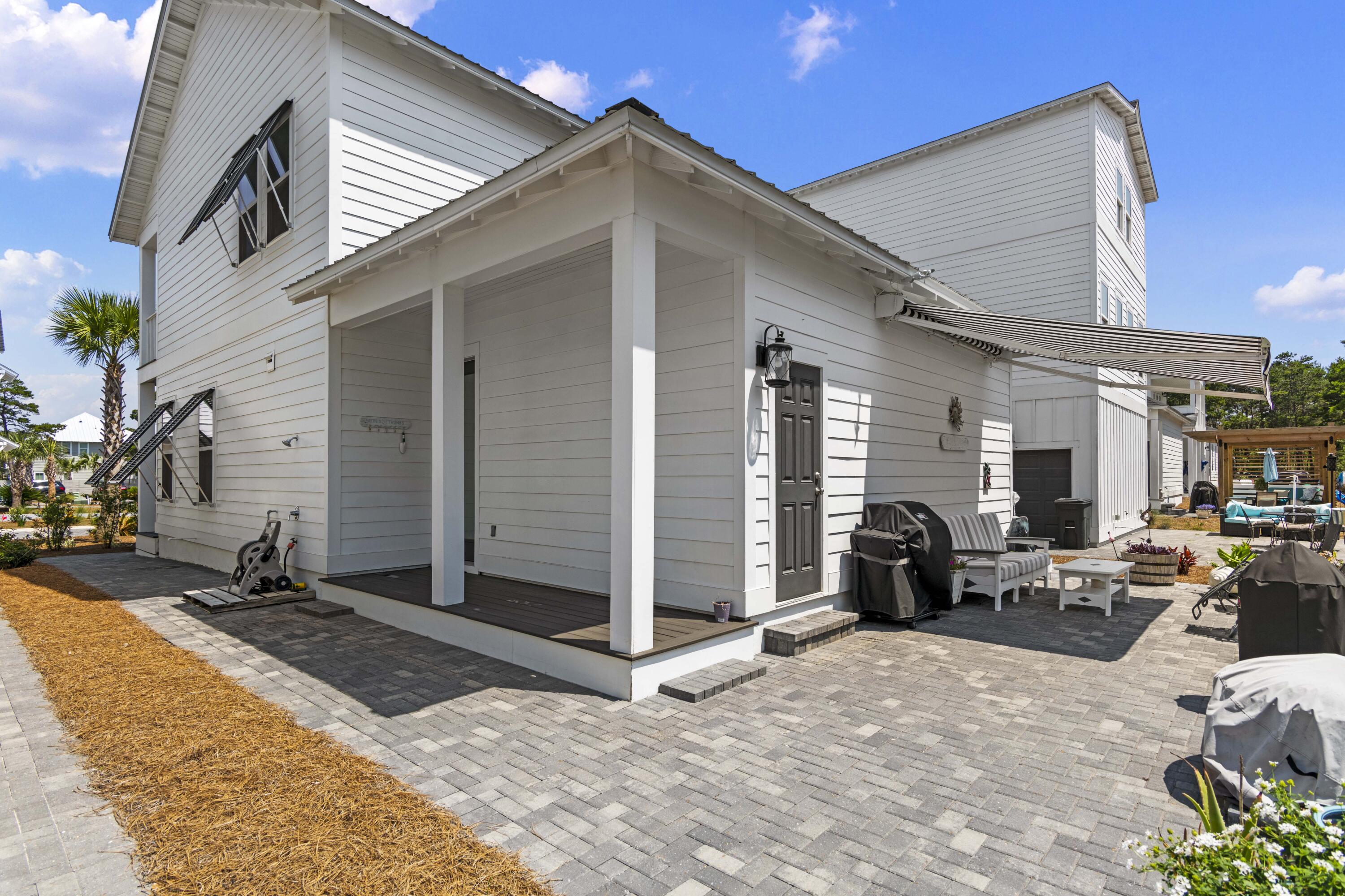 58 Beach View Drive Inlet Beach, FL 32461 - Photo 36 of 47 a view of a two couches in the patio and a building