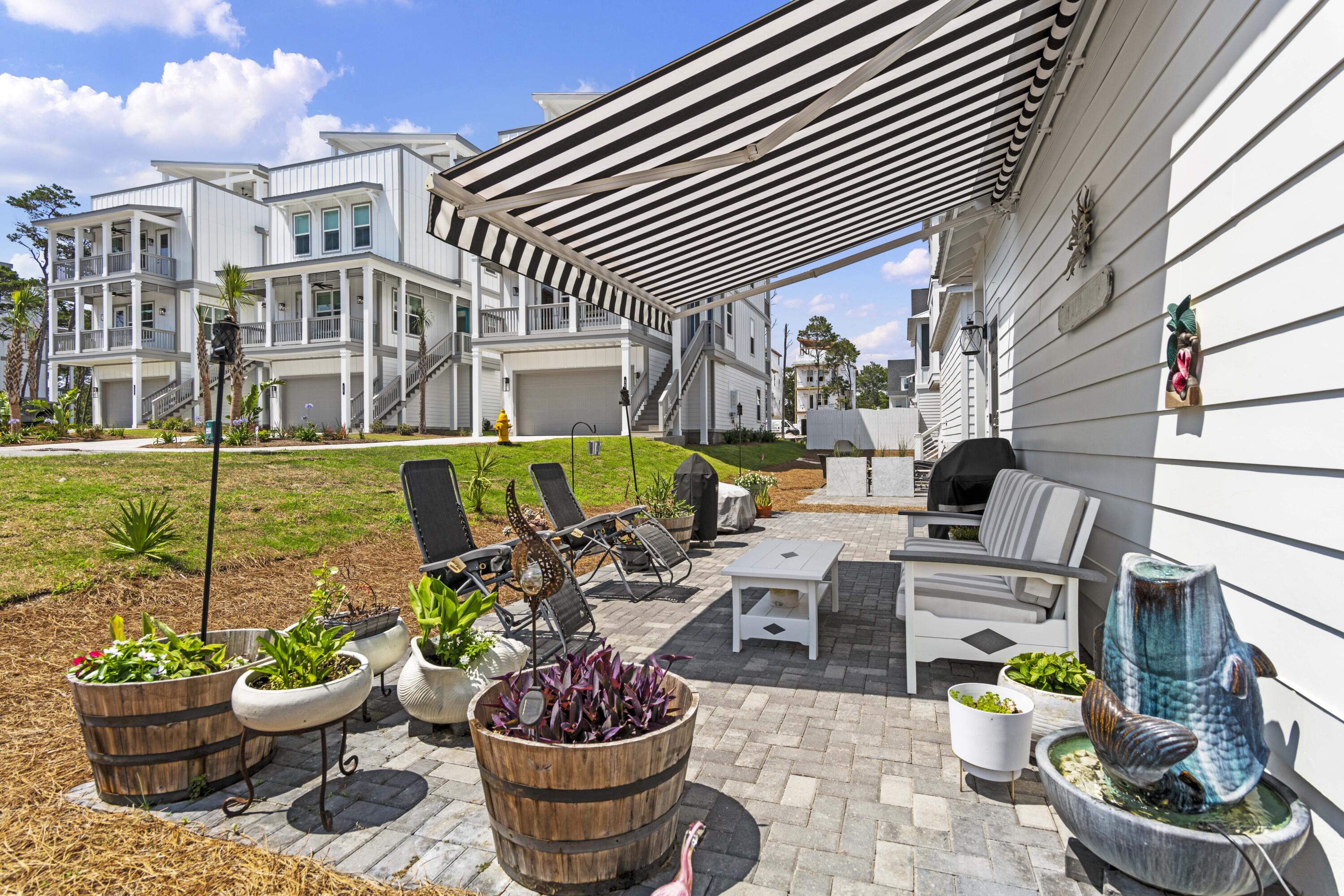 58 Beach View Drive Inlet Beach, FL 32461 - Photo 37 of 47 a view of a patio with furniture and plants