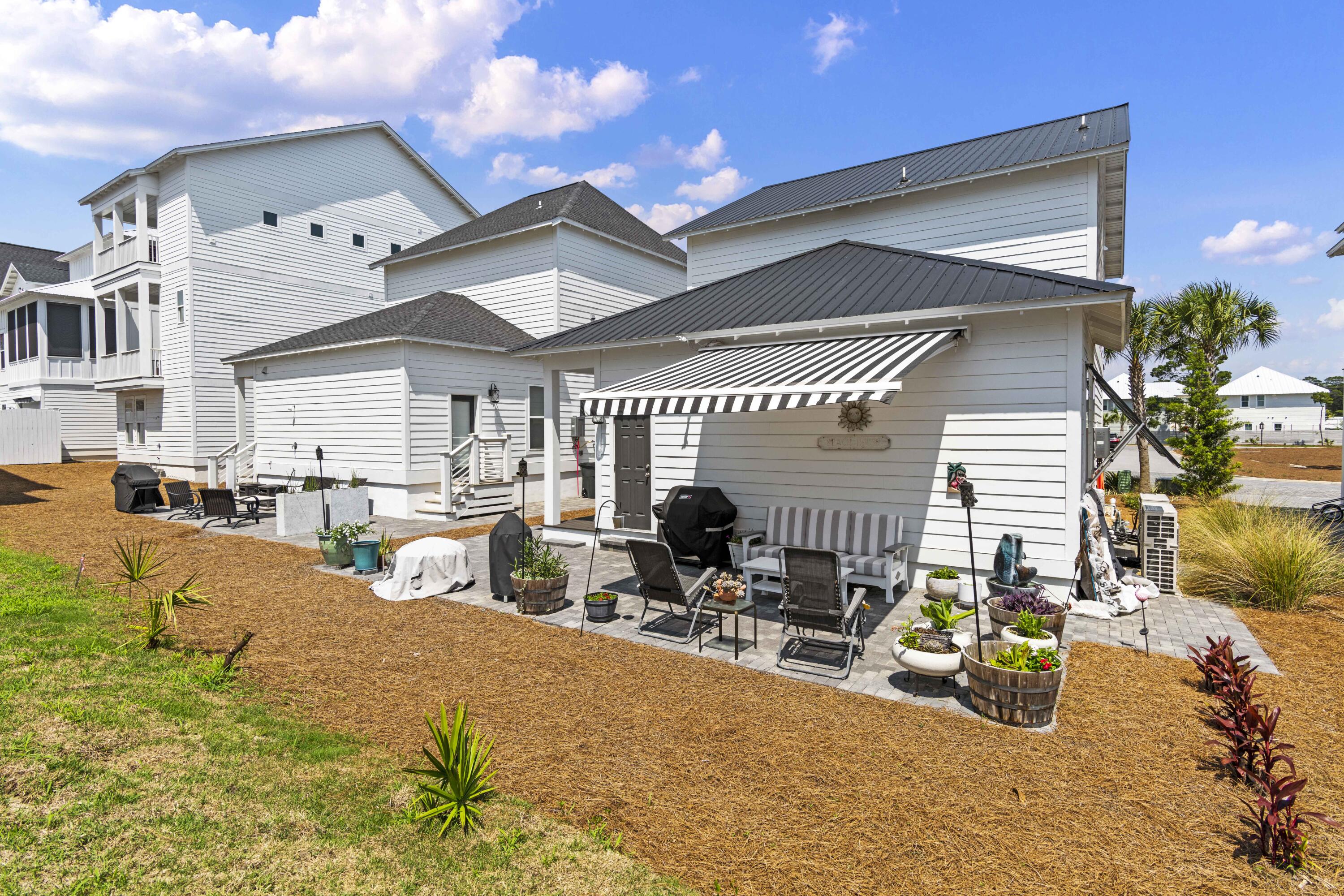 58 Beach View Drive Inlet Beach, FL 32461 - Photo 39 of 47 a view of a patio with swimming pool table and chairs