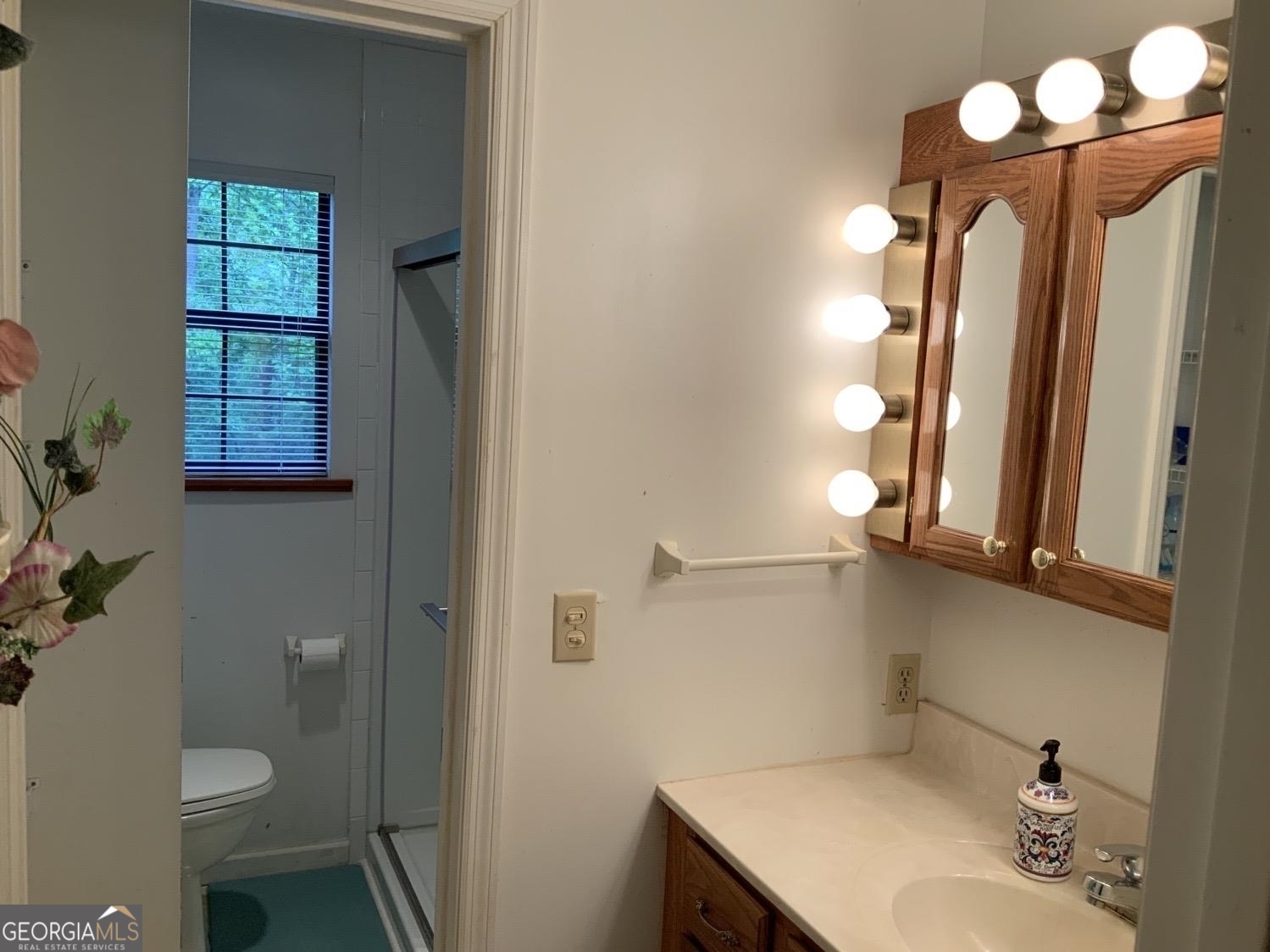 277 Hamilton Road Blairsville, GA 30512 - Photo 12 of 27 a bathroom with a sink vanity granite and toilet