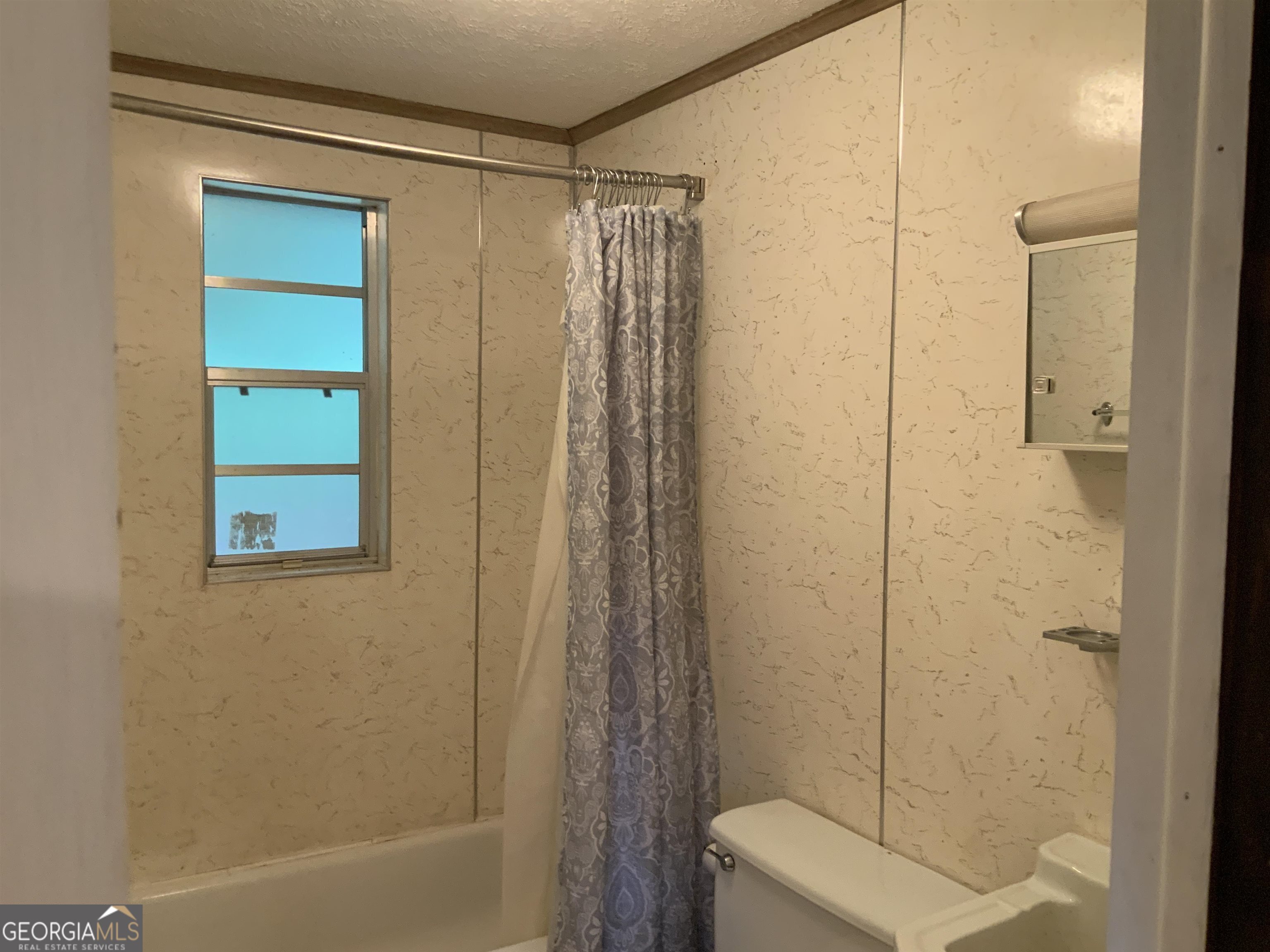 277 Hamilton Road Blairsville, GA 30512 - Photo 18 of 27 a bathroom with a shower and a tub