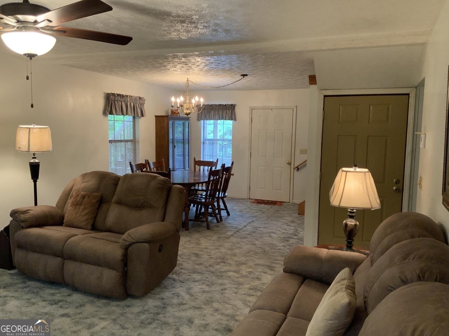277 Hamilton Road Blairsville, GA 30512 - Photo 4 of 27 a living room with furniture and a chandelier