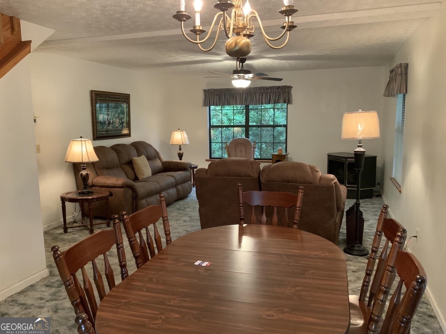 277 Hamilton Road Blairsville, GA 30512 - Photo 5 of 27 a view of a dining room with furniture a chandelier and wooden floor