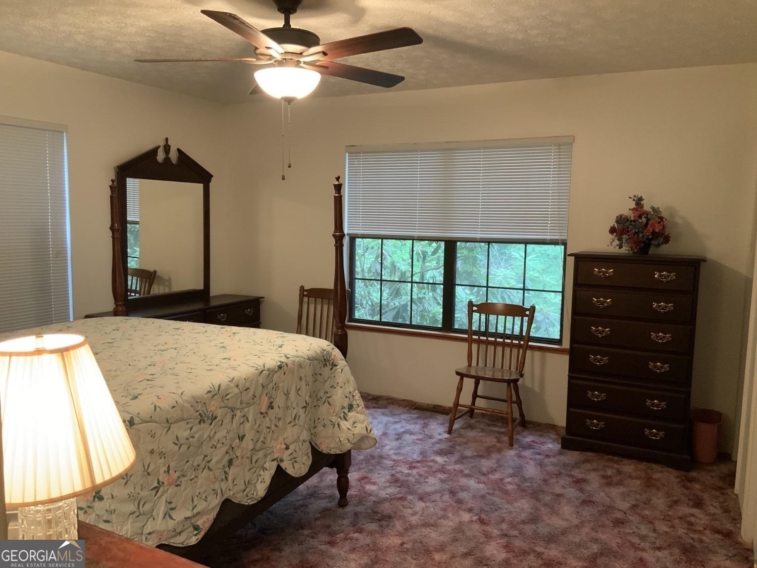 277 Hamilton Road Blairsville, GA 30512 - Photo 8 of 27 a bedroom with a bed dresser and a window