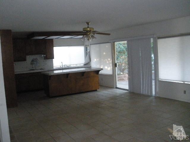 2693 Bancock Street Simi Valley, CA 93065 - Photo 2 of 6 a large kitchen with a sink and dishwasher a stove top oven with wooden floor