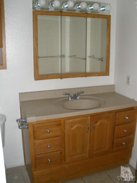 2693 Bancock Street Simi Valley, CA 93065 - Photo 4 of 6 a bathroom with a sink and a mirror