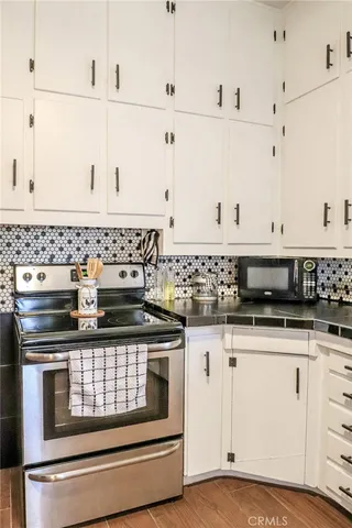 a bedroom with a bed and glass window