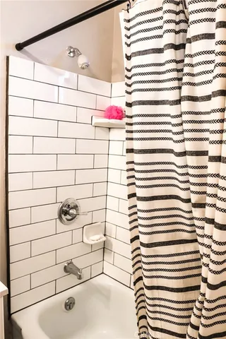 a view of a hallway with seating area