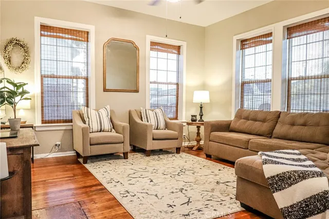 a view of a dining room with furniture and wooden floor