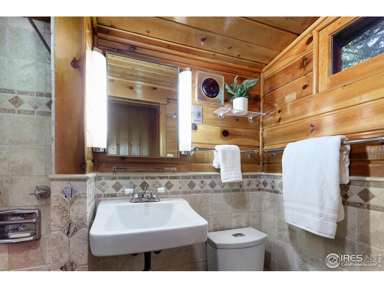 3443 Riverside Drive Lyons, CO 80540 - Photo 24 of 40 a bathroom with a sink and a mirror