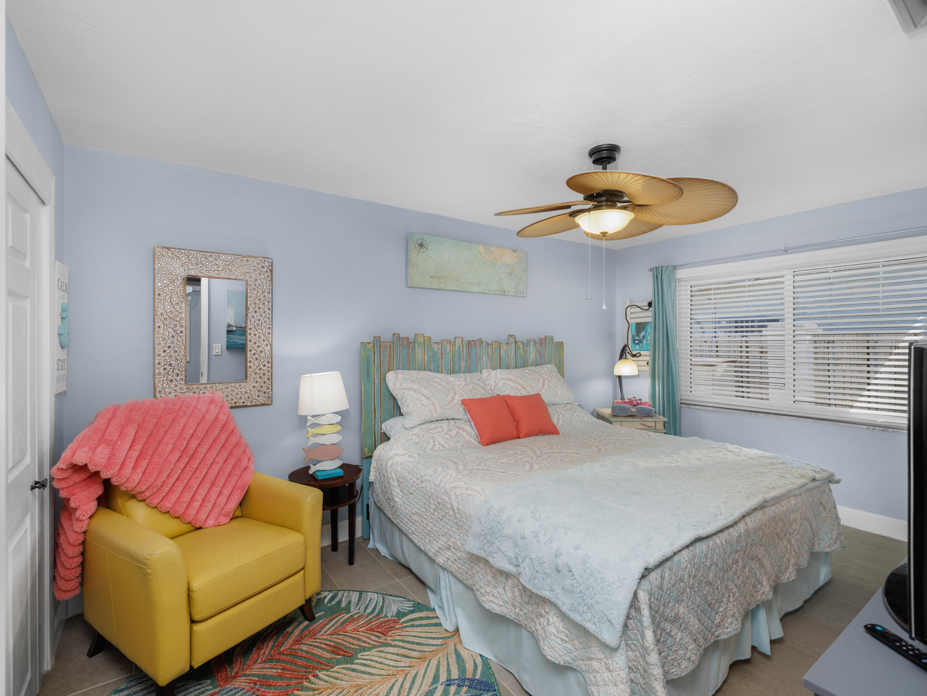 1657 Watson Boulevard Big Pine Key, FL 33043 - Photo 15 of 34 a bedroom with a bed and a couch