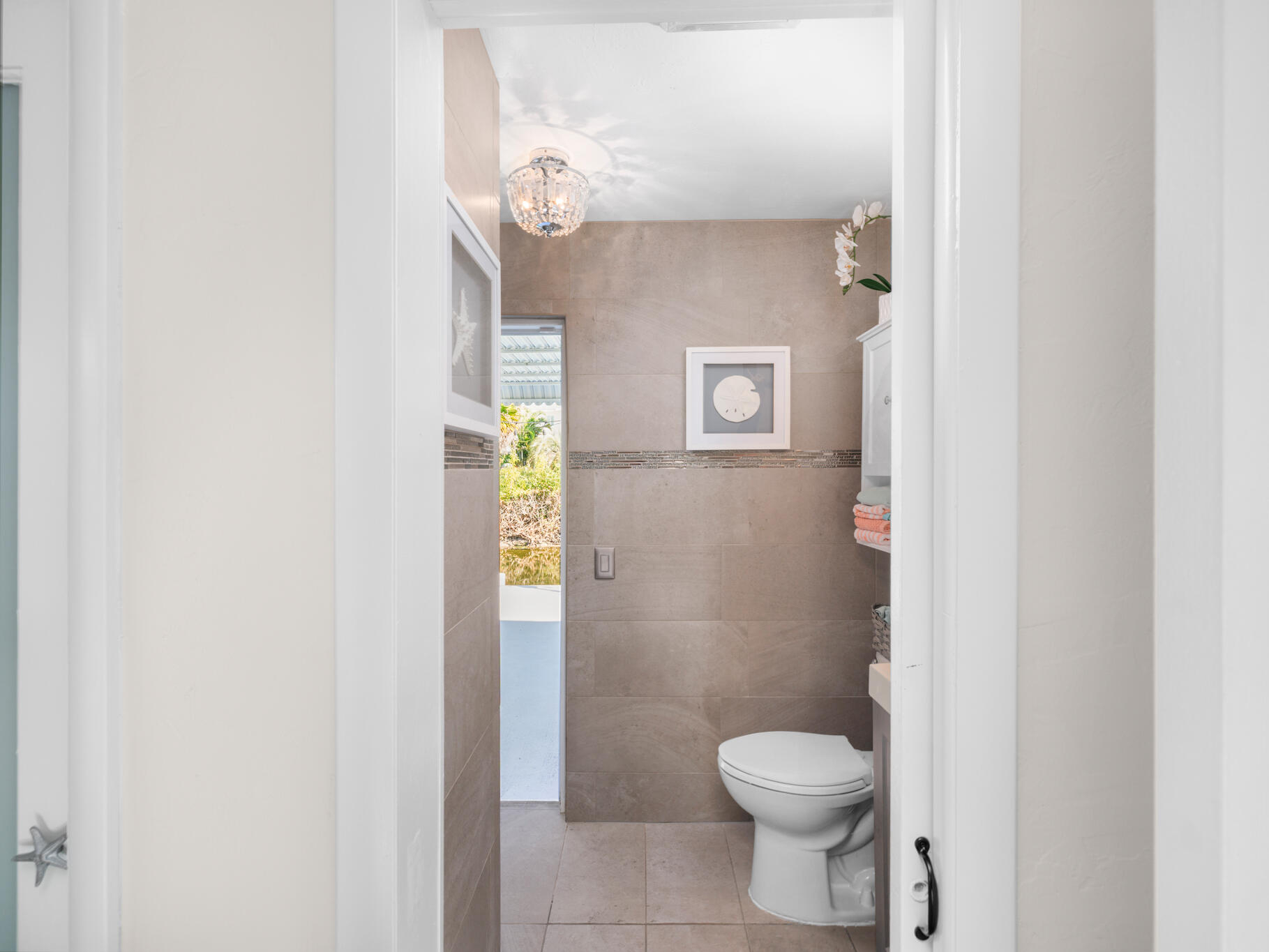 1657 Watson Boulevard Big Pine Key, FL 33043 - Photo 18 of 34 a bathroom with a granite countertop toilet and a sink