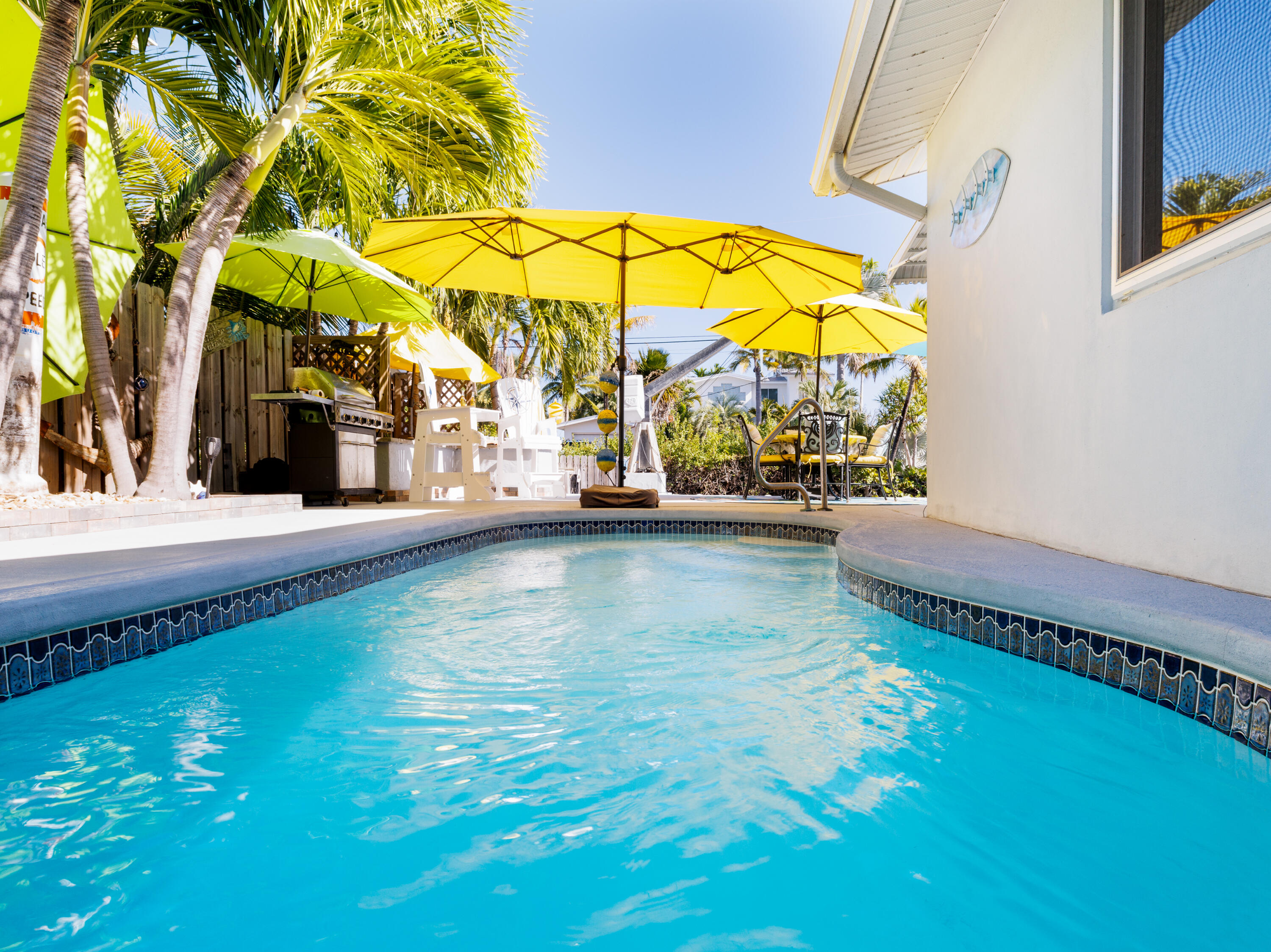 1657 Watson Boulevard Big Pine Key, FL 33043 - Photo 22 of 34 swimming pool with outdoor seating